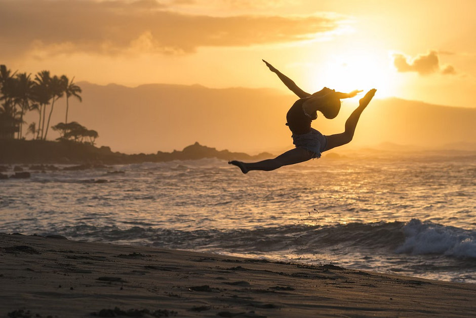 Woman Leaping on Beach | BioFit StL